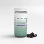 Naturecan Mushroom Gummies – clear bottle with teal label, Blackcurrant Flavour, 60 gummies, suitable for vegans, with round dark gummies beside it